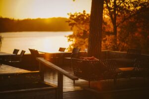 split-life retirement-sunset view of a lakeside deck